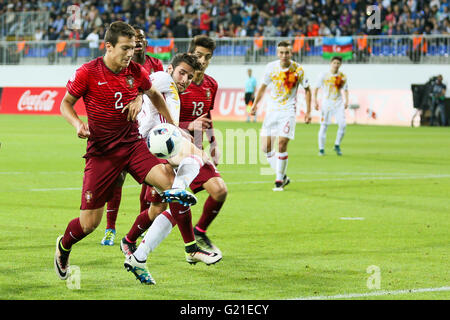 Baku, Azerbaijan. 21st May, 2016. Diogo Dalot (2) of Portugal fights for the ball with Spain's players during the 2016 UEFA European Under-17 Championship final football match Portugal vs Spain in Baku. Portugal beats Spain, 1-1. © Aziz Karimov/Pacific Press/Alamy Live News