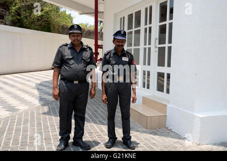 Two security guards outside the Fragrant Nature Hotel in Cochin India Stock Photo