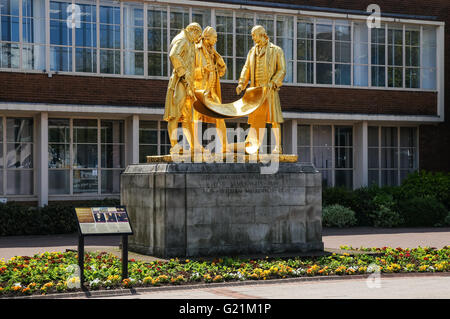 The gilded bronze statue of Matthew Boulton, James Watt and William Murdoch by William Bloye on Broad Street in Birmingham, UK Stock Photo