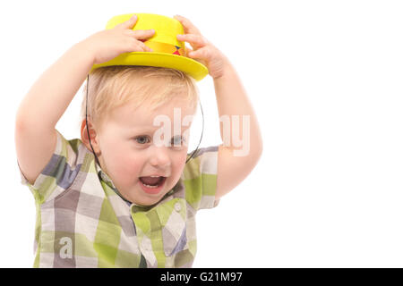Little Funny boy in shirt and funny hat. Isolated on white background Stock Photo