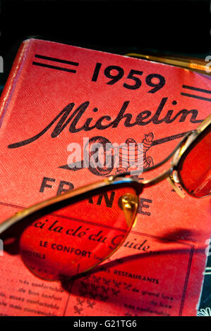 1950’s Vintage travel retro Zeiss sunglasses on 1959 Michelin French travel guide book 1959 on France Stock Photo