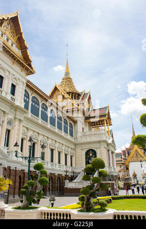 BANGKOK, THAILAND - AUGUST 21, 2014: Unidentified people by the Grand Palace in Bangkok. It is a complex of buildings at the hea Stock Photo