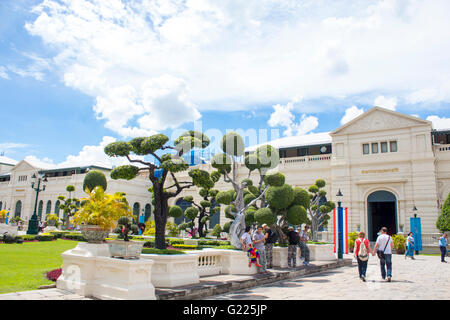 BANGKOK, THAILAND - AUGUST 21, 2014: Unidentified people by the Grand Palace in Bangkok. It is a complex of buildings at the hea Stock Photo