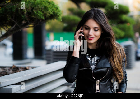 Shot of student talking on the phone outdoors