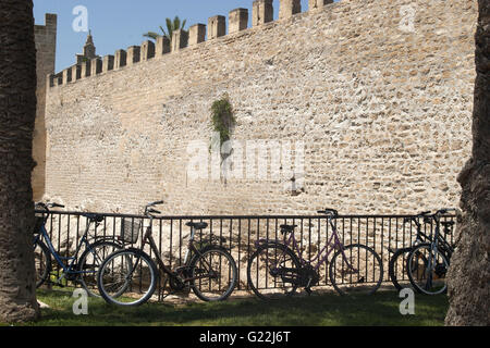 a beautiful photo of bicycles and Alcudia's Old Town fortress walls, Palma de Mallorca, Spain, seaside, tourism, holidays Stock Photo