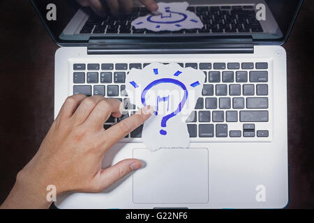 business, education, idea, inspiration and people concept - close up of male hands with paper sheet on computer keyboard Stock Photo