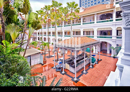 A view of the one of the courtyards in the Raffles Hotel in Singapore on July 11, 2012. Stock Photo