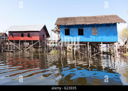 Light and on top of their stilts, the Inle Lake huts surprise visitors by the variety of their shapes and colours (Myanmar). Stock Photo