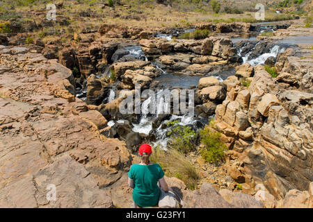 Visitor overlooking falls at the Blyde canyon, South Africa. Stock Photo