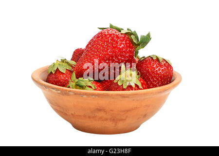 Mellow fresh red summer strawberries in rustic ceramic bowl isolated on white background, side view Stock Photo