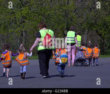 Nursery children om an outing with teachers Glasgow, Scotland, UK Stock Photo