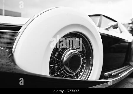 Vintage wheel at retro car. Black and white photo Stock Photo
