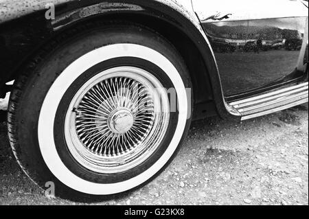 Vintage wheel at retro car. Black and white photo Stock Photo