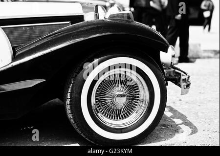 Vintage wheel at retro car. Black and white photo Stock Photo