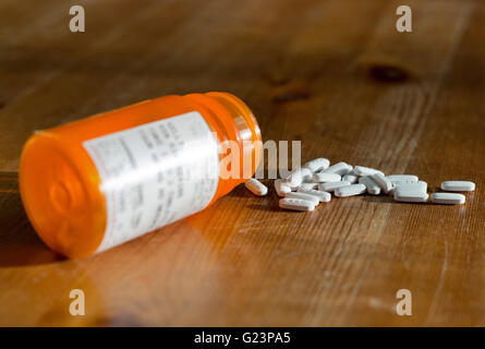 A spilled bottle of prescription pills. Stock Photo