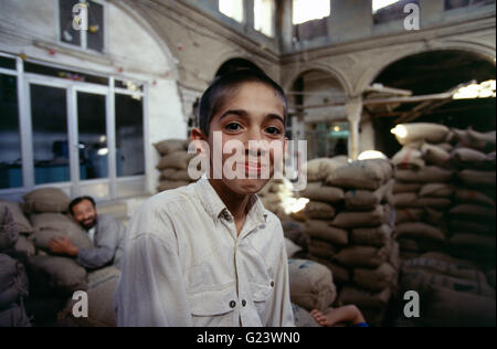 Portrait of an Iranian school boy in Tehran bazaar Stock Photo