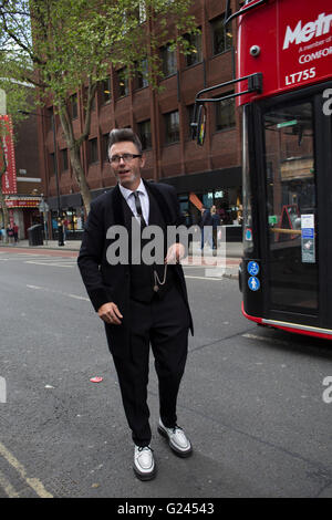 Teddy Boys gather outside a pub in Soho following a 40th anniversary of their infamous march on the BBC to protest that they wanted more rock and roll on the radio, which they recreated today on May 14th 2016 in London, United Kingdom. Teddy Boy, also known as Ted, is a British subculture typified by men wearing clothes that were partly inspired by the styles worn by dandies in the Edwardian period, which tailors had attempted to re-introduce in Britain after World War II. It is sometimes inaccurately written that the Teddy Boy style and phenomenon appeared in Britain during the mid 1950s as a Stock Photo