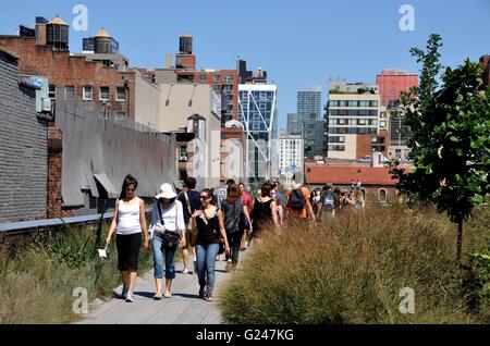 New York City:  View of the High Line Park's Section 1 looking north from West 18th Street built on an elevated railway tracks Stock Photo