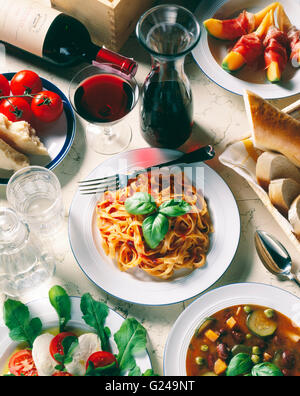 Italian national cuisine, Tagliatelle with tomato sauce, Parmesan cheese, mozzarella cheese, minestrone soup Stock Photo