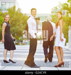 happy smiling business team over office room Stock Photo - Alamy