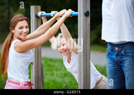 Two women doing fitness training together in nature Stock Photo