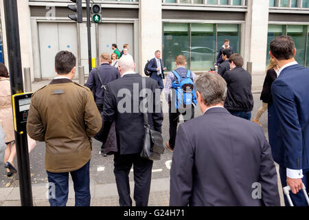 Business people in a variety of clothing heading home at the end of a day in the City of London Stock Photo