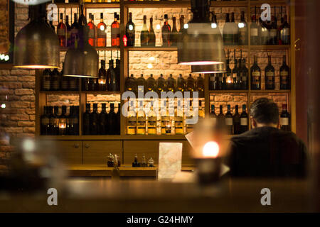 man sitting alone in bar / restaurant Stock Photo