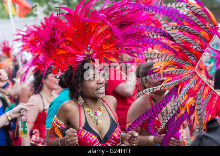 Portrait of dancing woman in costume on Carnival of Cultures  (Karneval der Kulturen)   in Berlin, Germany. Stock Photo