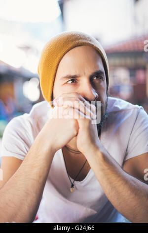 Portrait of a young man wearing yellow hat Stock Photo