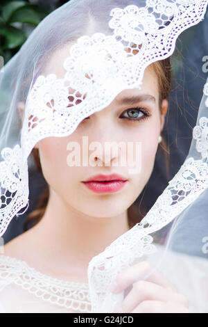 Portrait of a beautiful young bride in a veil Stock Photo