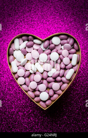 Generic pills and capsules in heart shape. Generic pills and capsules in heart shape.
