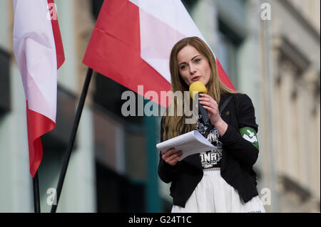 Wroclaw, Poland. 02nd Apr, 2016. Justyna Helcyk, Coordinator of ONR  (National Radical Camp)delivers a speech during anti immigrant and anti  Muslim protest organized by Oboz Narodowo-Radykalny (National Radical Camp)  in Wroclaw, western