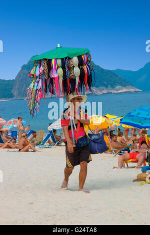 Swimsuit seller on Copacabana beach Stock Photo