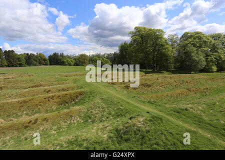 Remains of ditches and ramparts and access road to Ardoch Roman Fort near Braco Scotland  May 2016 Stock Photo