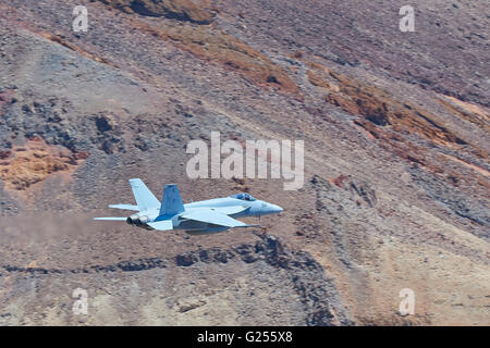 United States Navy F/A-18E Super Hornet Flying Along Rainbow Canyon (Star Wars Canyon), California, USA. Stock Photo