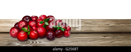 Fresh forage cranberries with leaves on wooden table. Clipping paths, infinite depth of field Stock Photo