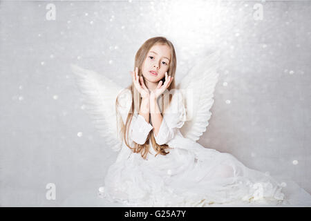 Portrait of a Girl wearing angel wings Stock Photo