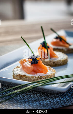 Canapes with smoked salmon and cream cheese Stock Photo