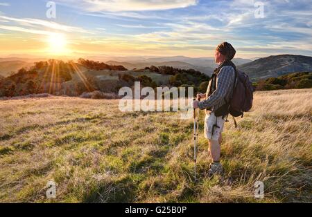 Man hiking and looking at view, Vulcan Mountain Wilderness Preserve, California, United States Stock Photo