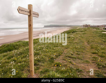 The beach at Marske on the north east coast of England with the direction sign showing England Coast Path Stock Photo