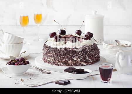 Black forest cake ,decorated with whipped cream and cherries Schwarzwald pie, dark chocolate and cherry dessert Stock Photo