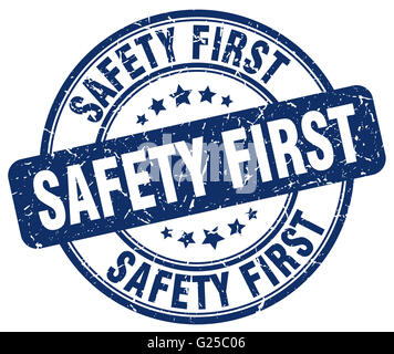 safety first round blue sticker isolated on white Stock Photo - Alamy