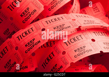 Unwound Messy Roll of Red Tickets Piled Up. Stock Photo