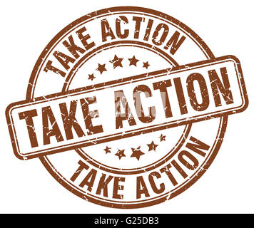 take action brown grunge round vintage rubber stamp Stock Photo