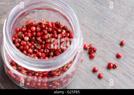 pink pepper in a glass jar Stock Photo