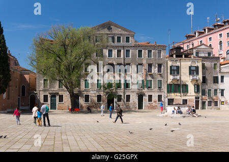 Locals and tourists mingle in Campo San Polo, the second largest square in Venice after Piazza San Marco Stock Photo