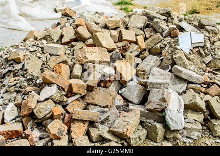 A bunch of bricks in one place after the demolition of the building. Stock Photo