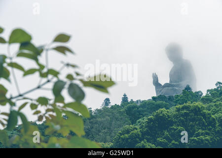 Buddha statue in the fog with faded filter Stock Photo