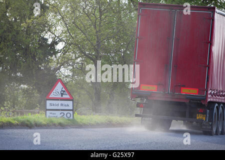 Skid risk for slowing truck on re-surfaced British road. Stock Photo