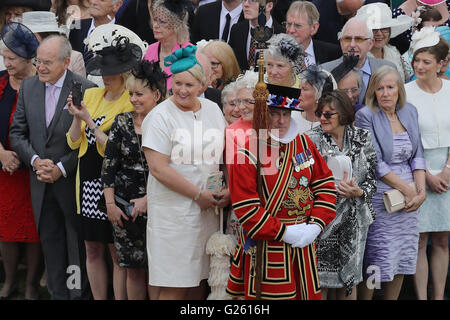 Guests attend a garden party at Buckingham Palace in London. Stock Photo